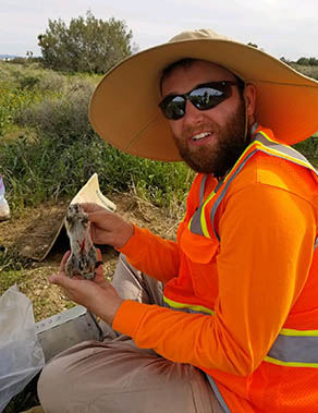 As part of a ground squirrel survey in the Mojave National Preserve, Dalton Stanfield marks an antelope ground squirrel with red ink to help monitor future recaptures.