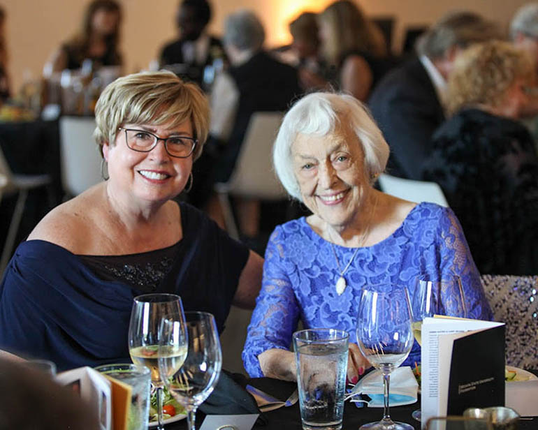 Finding some time to chat at the Fairmount Society dinner were Marilyn Pauly and Mickey Armstrong.