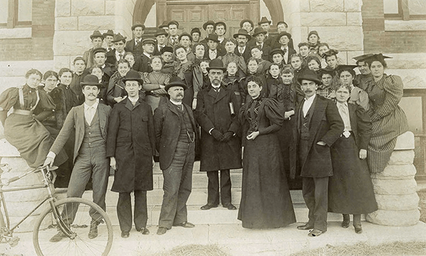 Students attend the university’s inaugural day of classes on September 11, 1895.