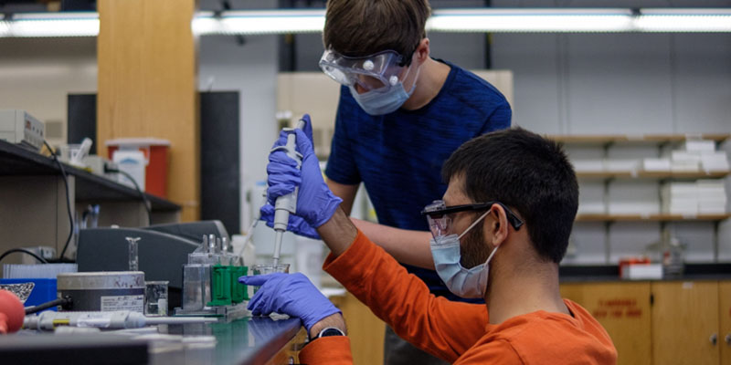 Two students in a chemistry lab