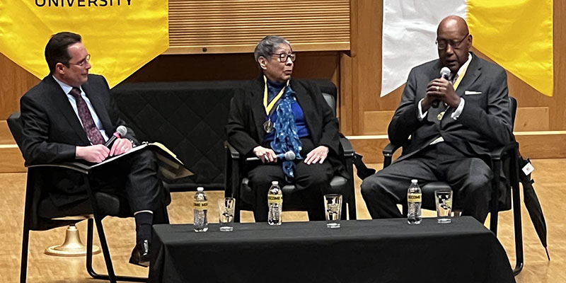 Fairmount College Dean Andrew Hippisley, left, moderates a panel discussion with Hall of Fame inductees Elvira Crocker ’61/61 and Louis Sturns ’71, right.