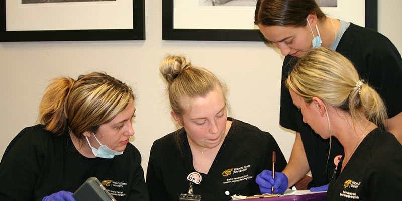 Students work through a learning plan in the Cassat Speech-Language-Hearing Clinic at WSU.