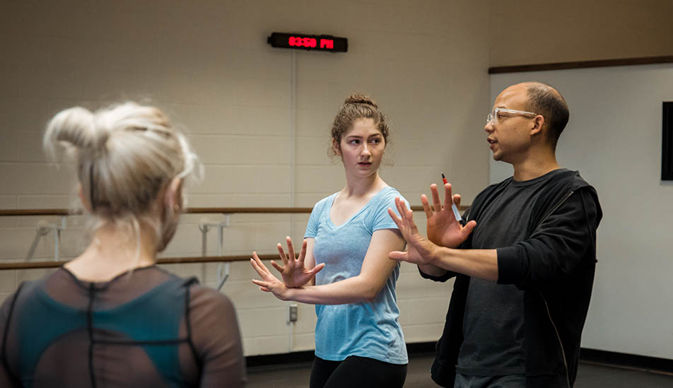 Wichita State student learning dance from New York City guest lecturer