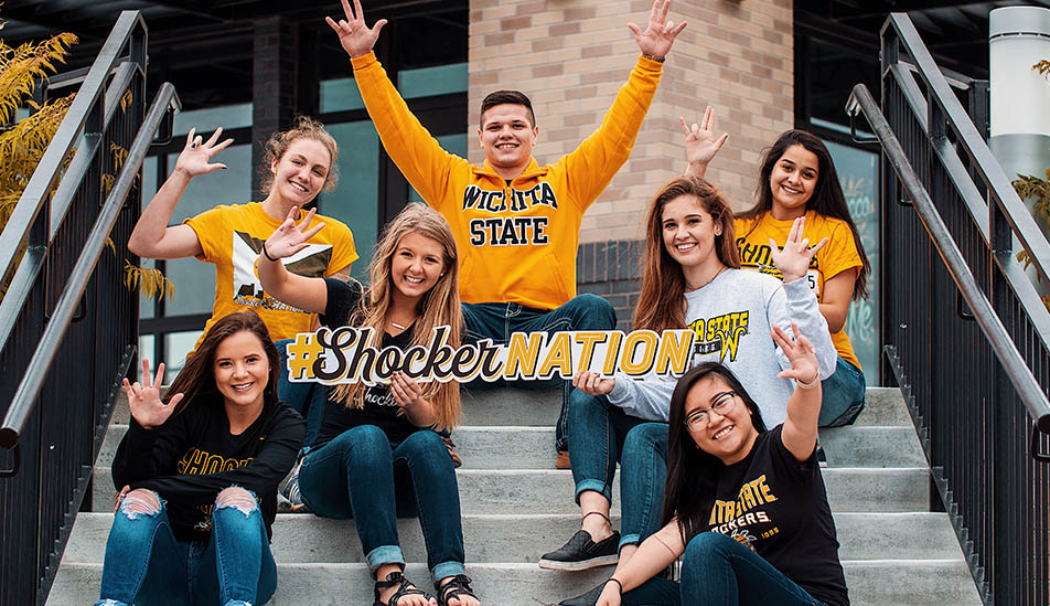 Wichita State students pose for a photo on campus