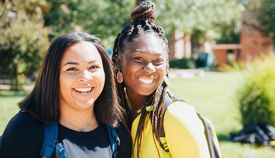 Wichita State students pose for a photograph on campus