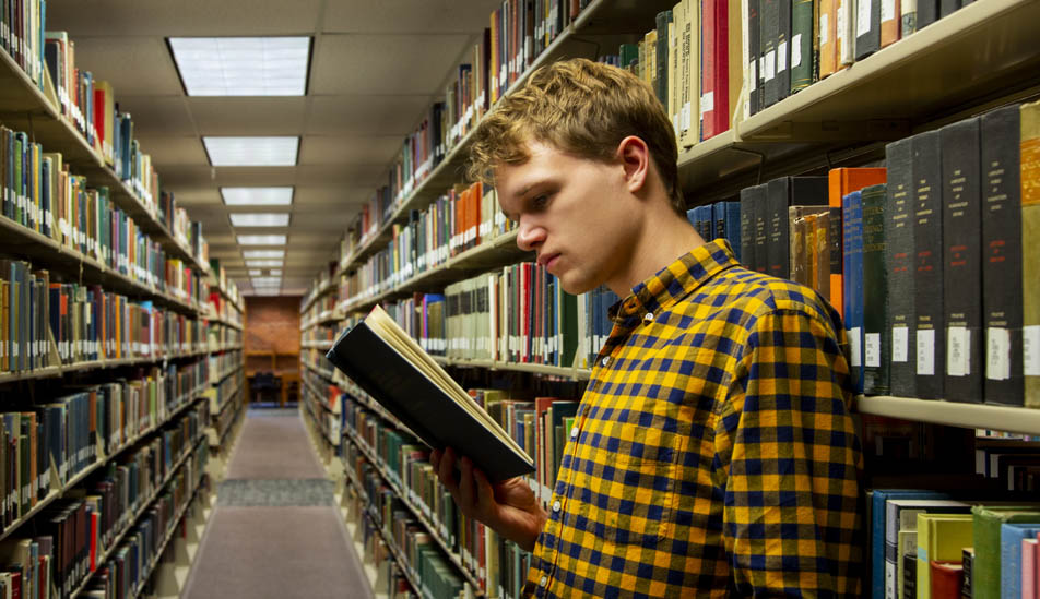 Daniel Saunders studying in the Ablah Library at Wichita State University