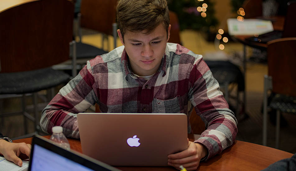 Wichita State Student studying in the Ablah Library