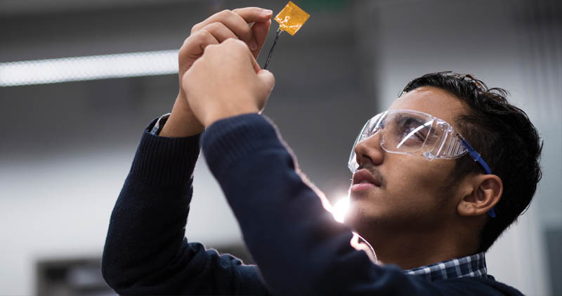 WSU student Subash Bhandari looks at a smart-skin sensor in the EEB’s Biomedical Sensors, Imaging and Modeling Engineering Lab.