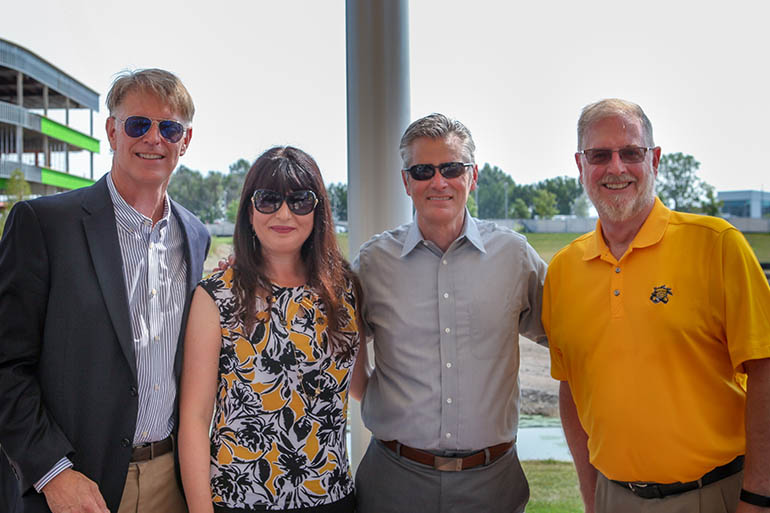 From left, WSU First Gentleman Rick Case, Barton School Dean Larisa Genin, WSU President Rick Muma and Fidelity Bank Chairman Clark Bastian.
