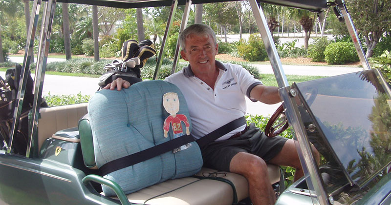 Bob young in golf cart
