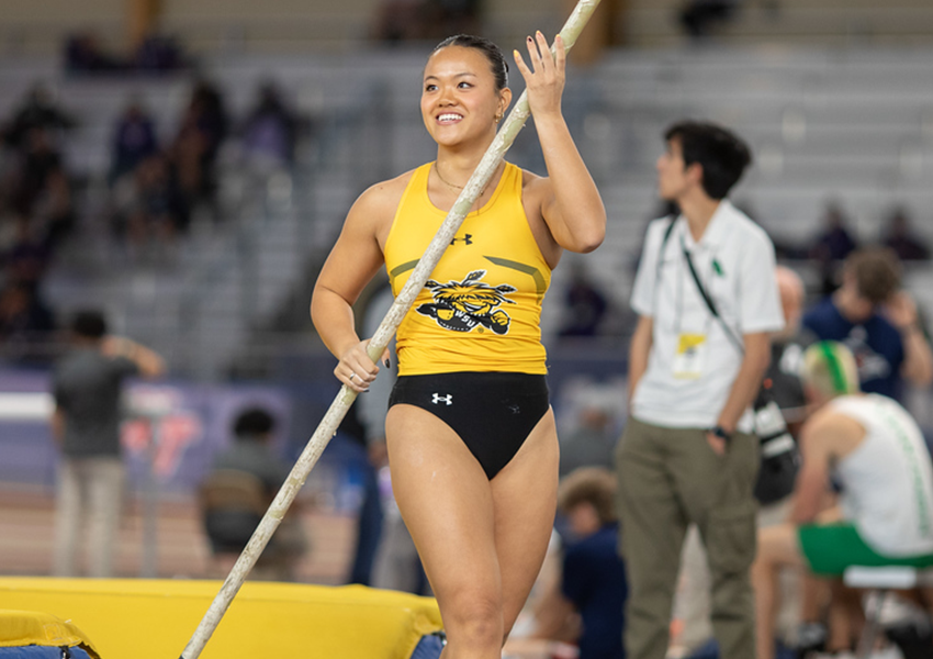 Abby Rexford preparing to pole vault at a competition